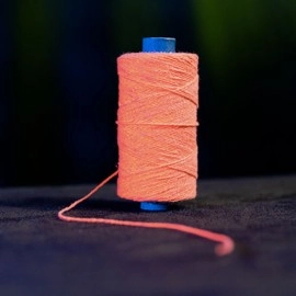 WGM UV GLOW GYPSY THREAD ORANGE REFILL SPOOL by Murphy's Magic